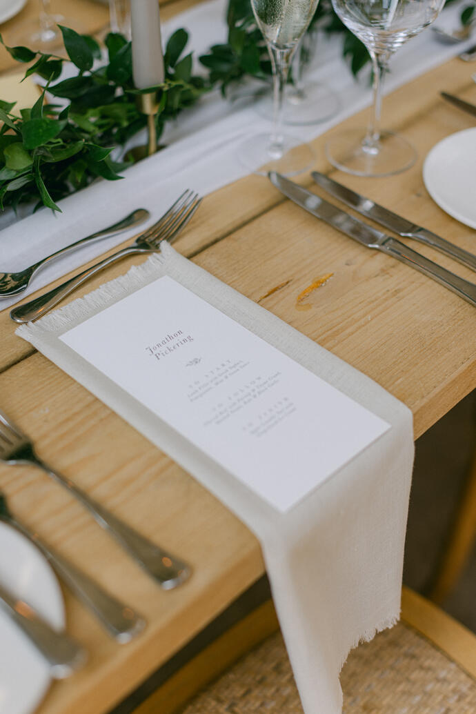 Wedding place setting at The Fig House at Middleton Lodge A Fringed napkin styled with a personalised menu