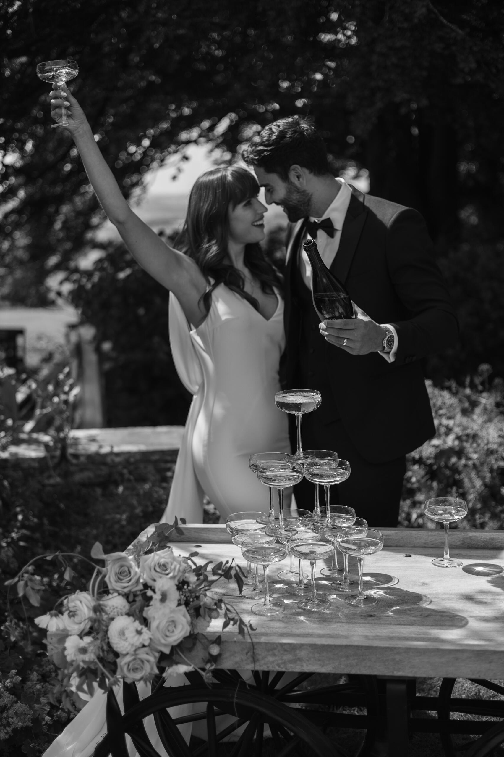 Bride and groom with a champagne tower